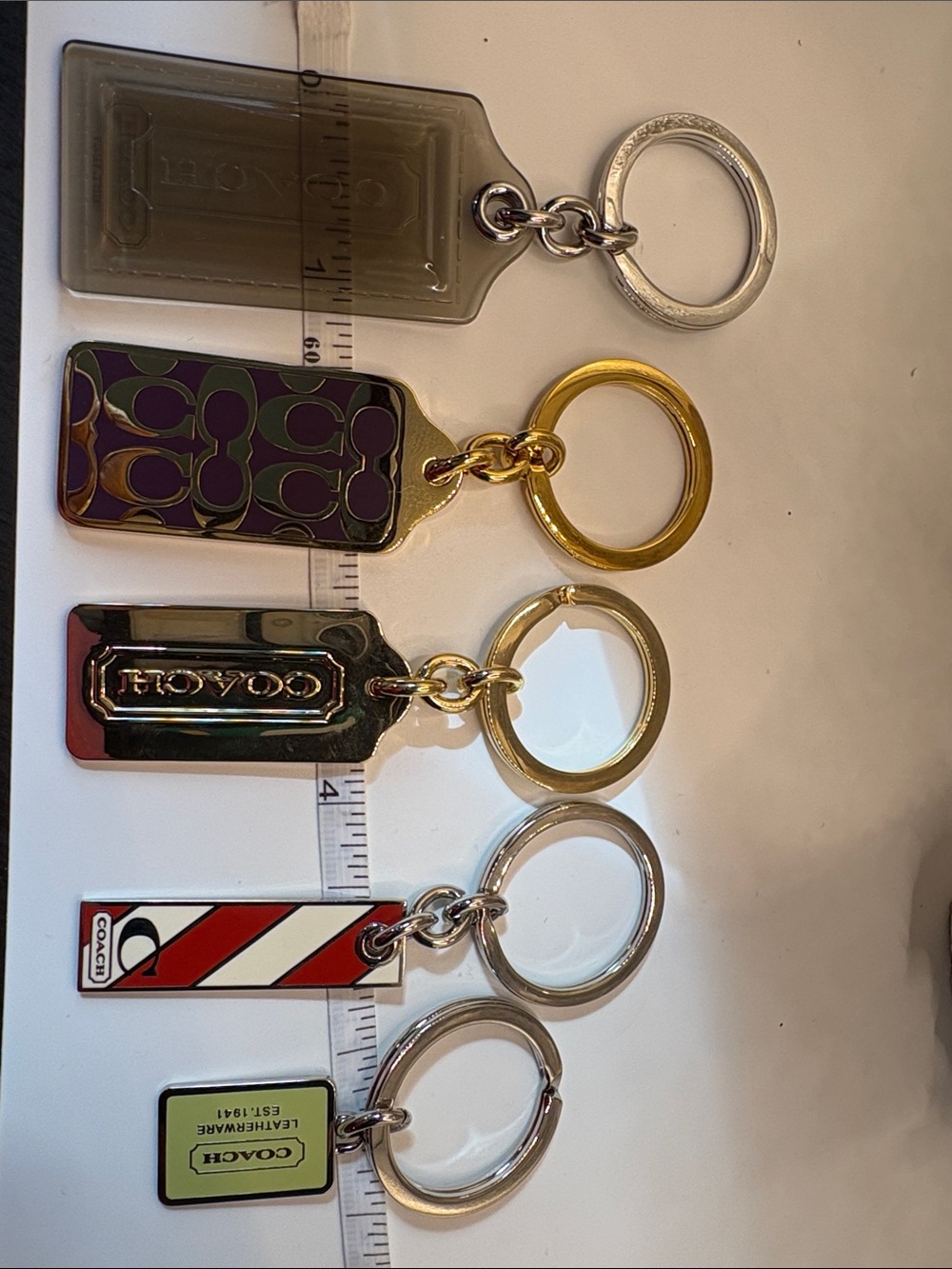 Coach Multi-Tag Keychain Set in Purple, Gold, Silver, Red, Green